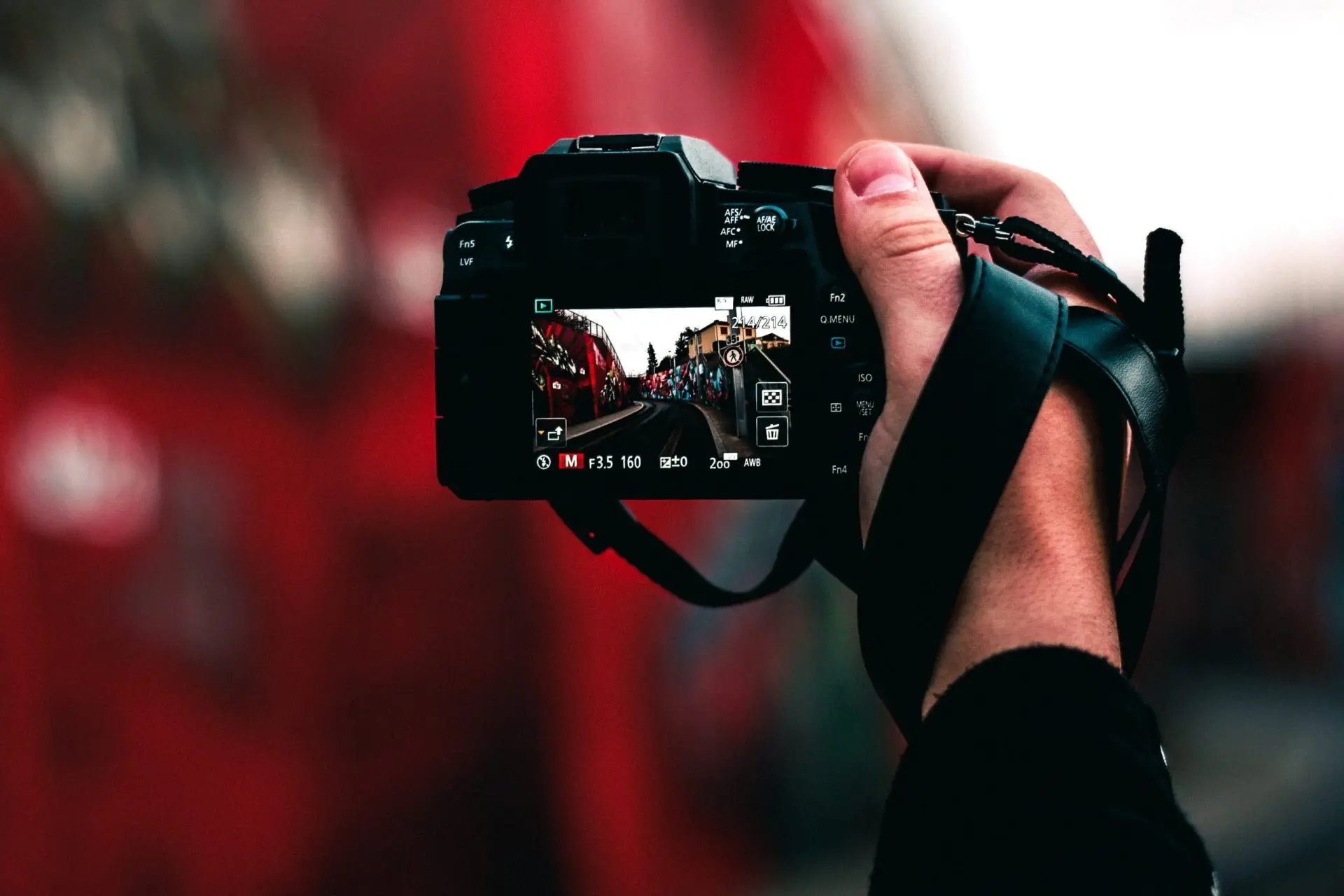 portrait photographer taking picutre in a dslr camera