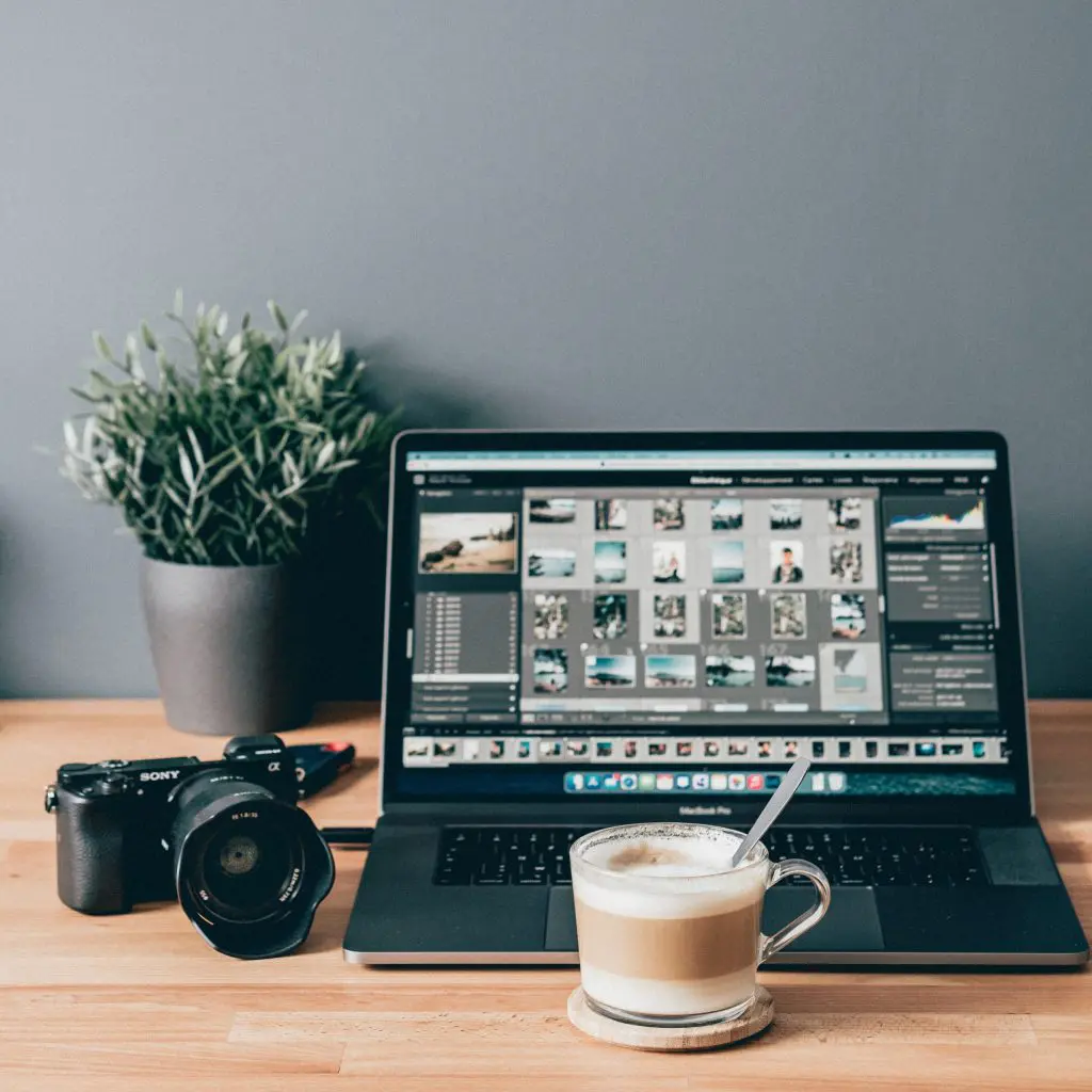 macbook pro laptop and a cup of coffee