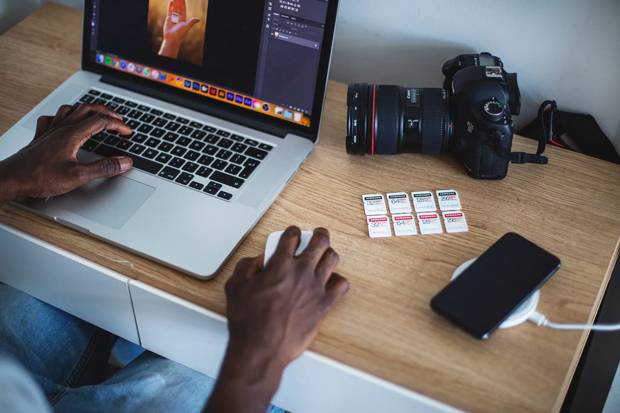 wedding photographer editing photos in macbook